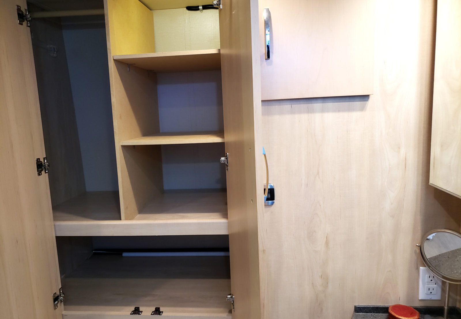 Inside RV wardrobe with shelves