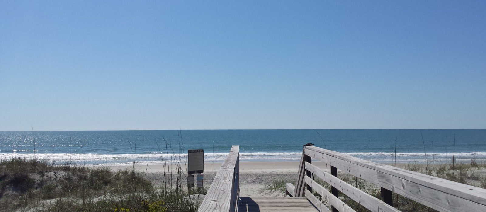 boardwalk with beach beyond