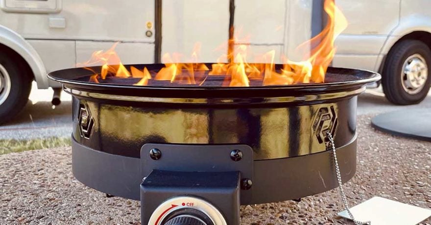 Propane Fire pit in front of a Leisure Travel Van Unity FX