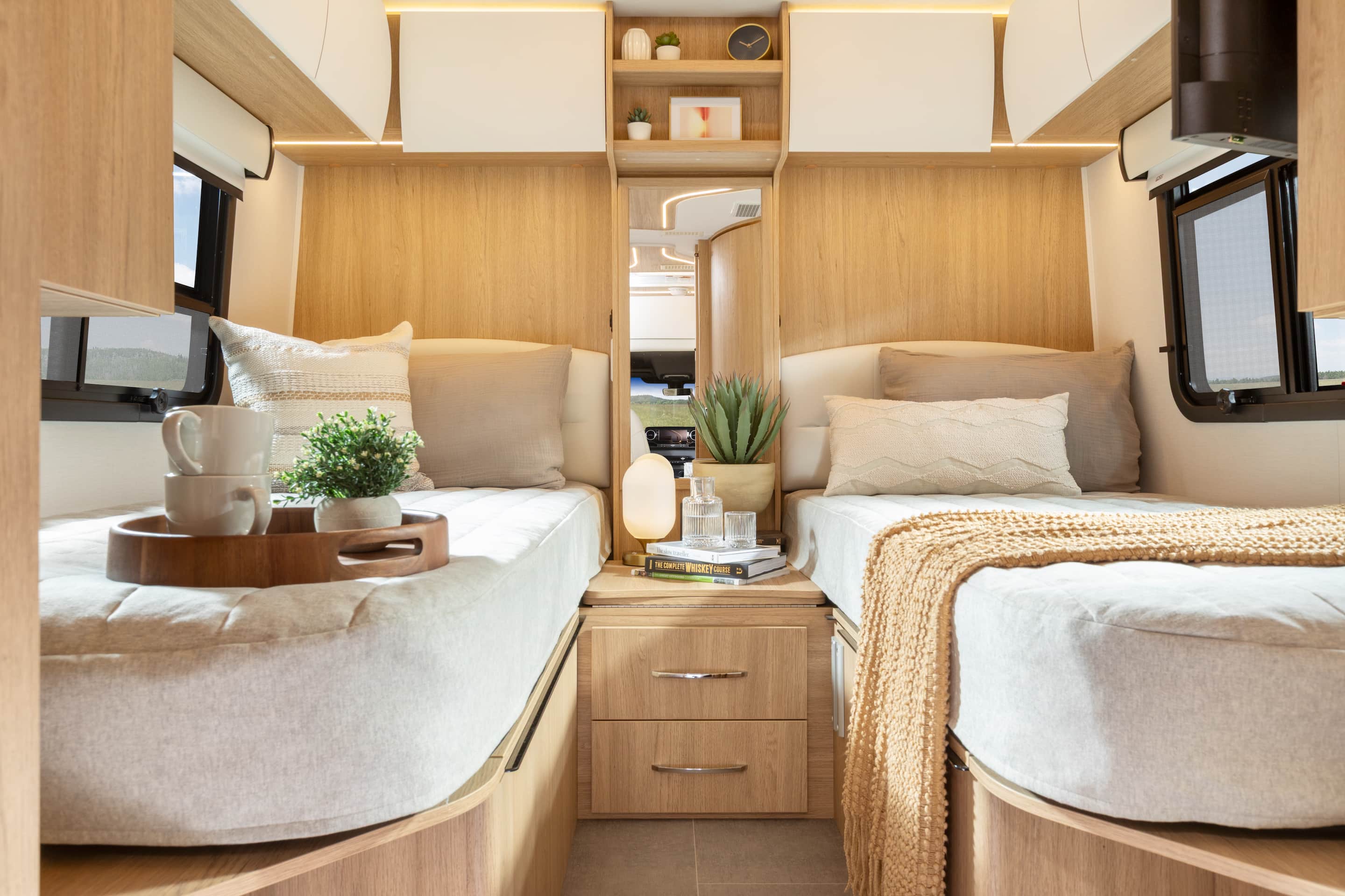 Unity Twin Bed shown with Rift Oak cabinetry, Crystal White cabinetry, Concrete countertops, and Dove upholstery.