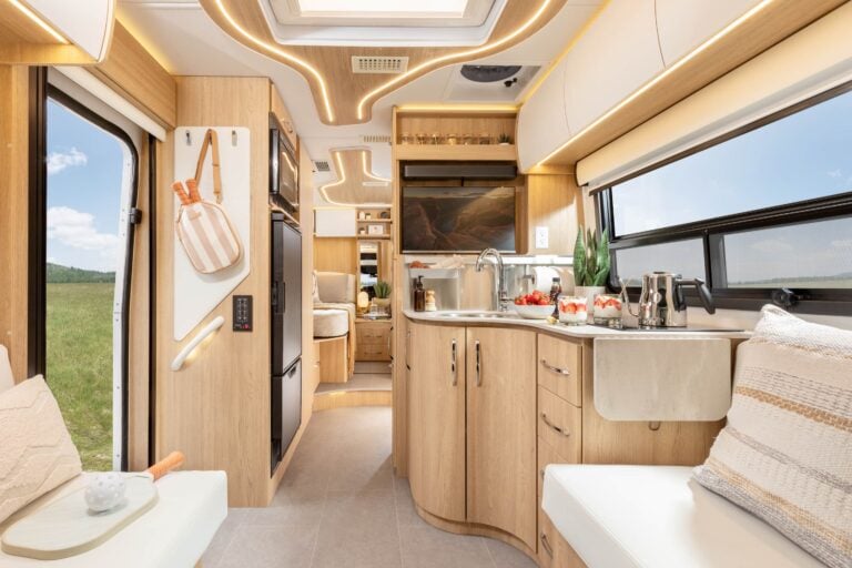 Unity Twin Bed shown with Rift Oak cabinetry, Crystal White cabinetry, Concrete countertops, and Dove upholstery.