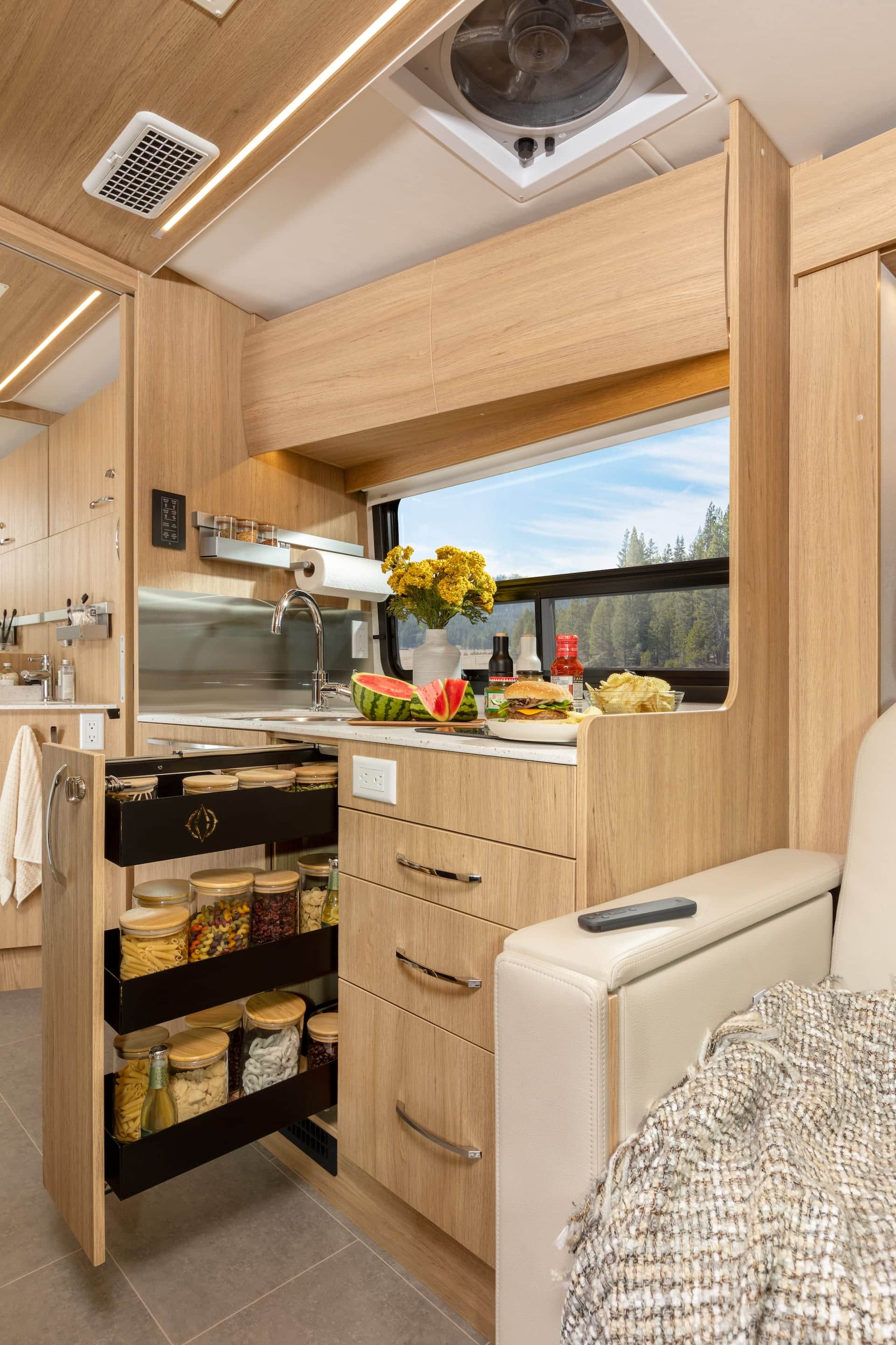 Wonder Murphy Bed Lounge shown with Rift Oak cabinetry, Mineral countertops, and Sand upholstery.